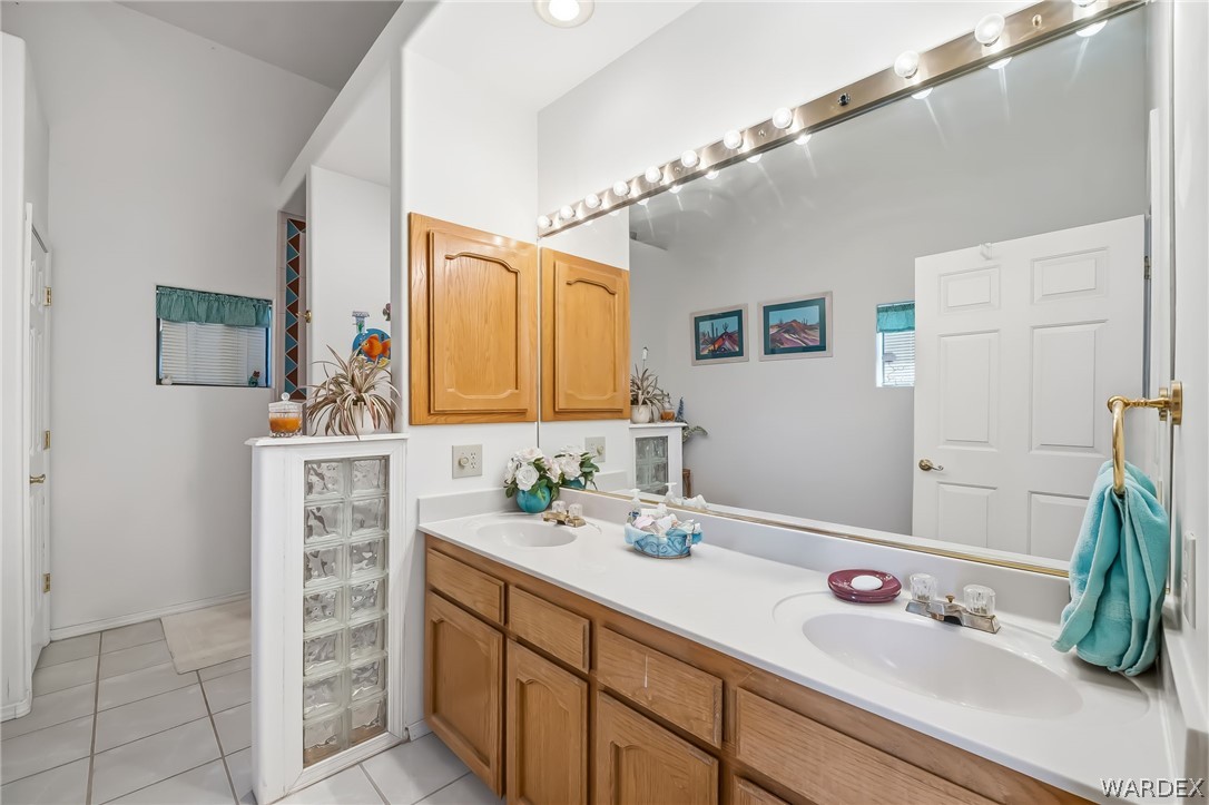 2401 North Stephan Road Kingman, AZ 86401 - Photo 44 of 92 Dual vanity with integrated sinks and a white countertop