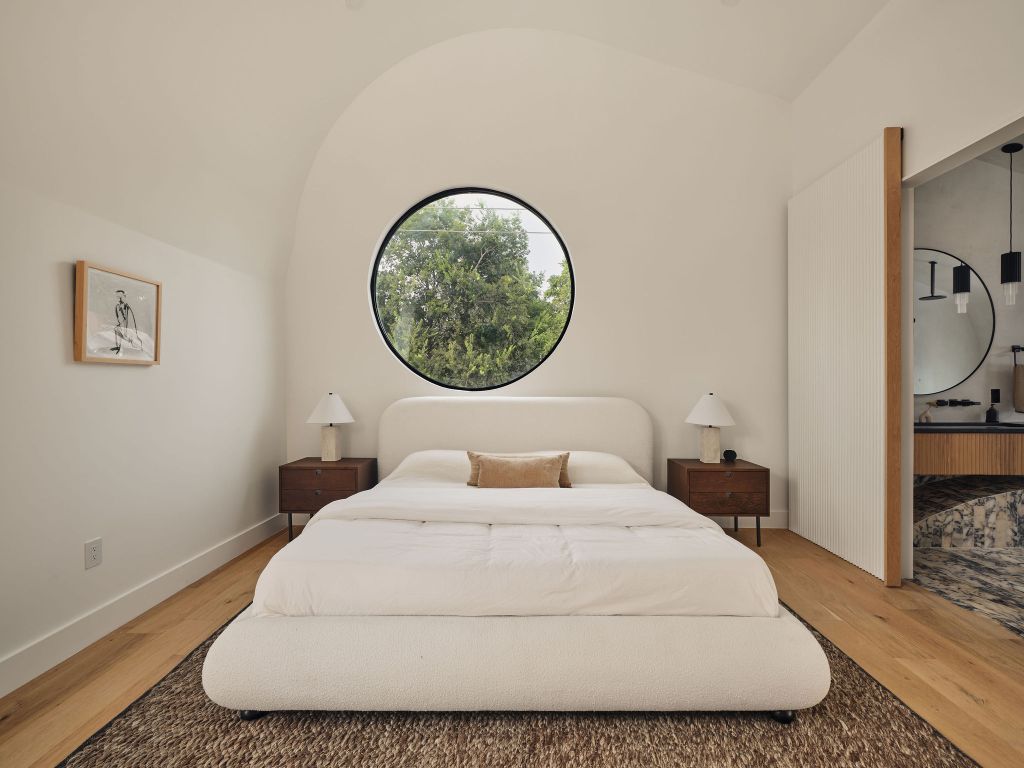 2201 Garden Street Austin, TX 78702 - Photo 19 of 40 a bedroom with a bed and a painting on the wall