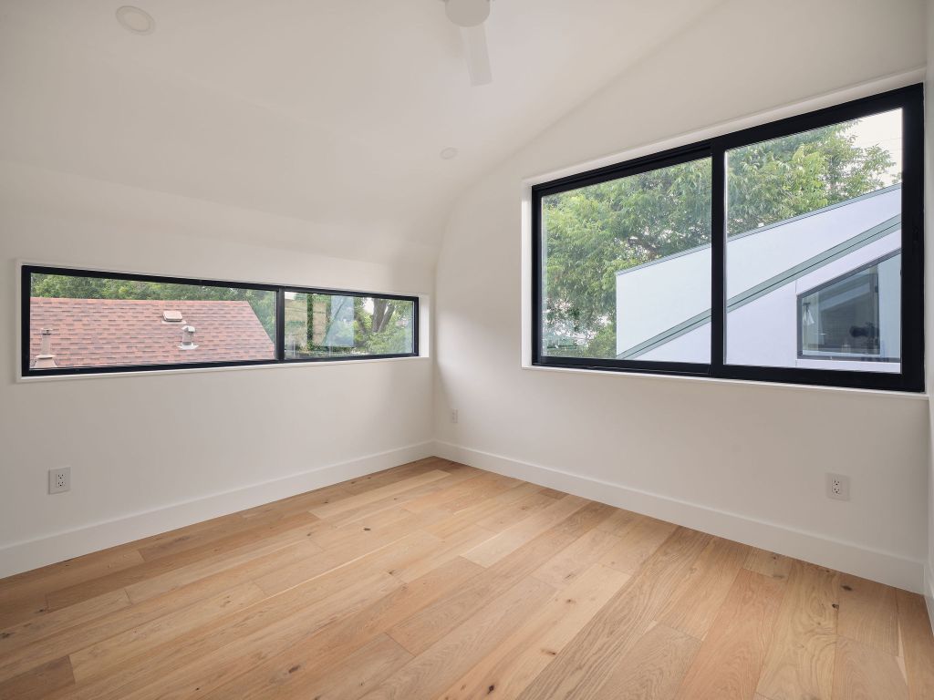 2201 Garden Street Austin, TX 78702 - Photo 25 of 40 a view of a big room with wooden floor and windows