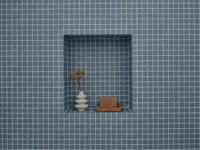 a bathroom with a blue wall