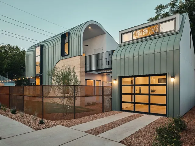 a front view of a house with garage