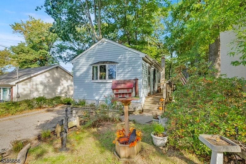 a backyard of a house with barbeque oven
