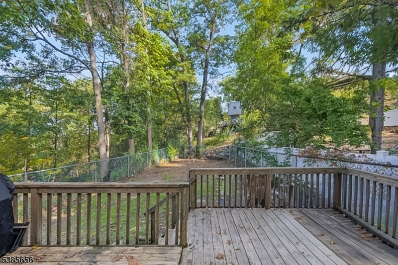 5 Geneva Trail Hopatcong, NJ 07843 - Photo 9 of 9 a balcony with wooden floor and fence
