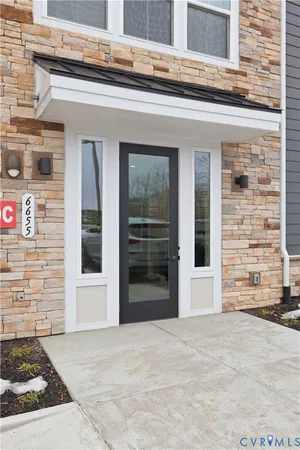 a view of a brick house with a large windows