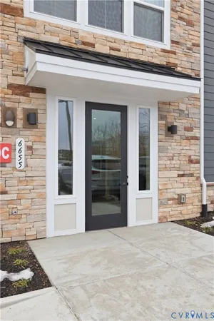 a view of a brick house with a large windows