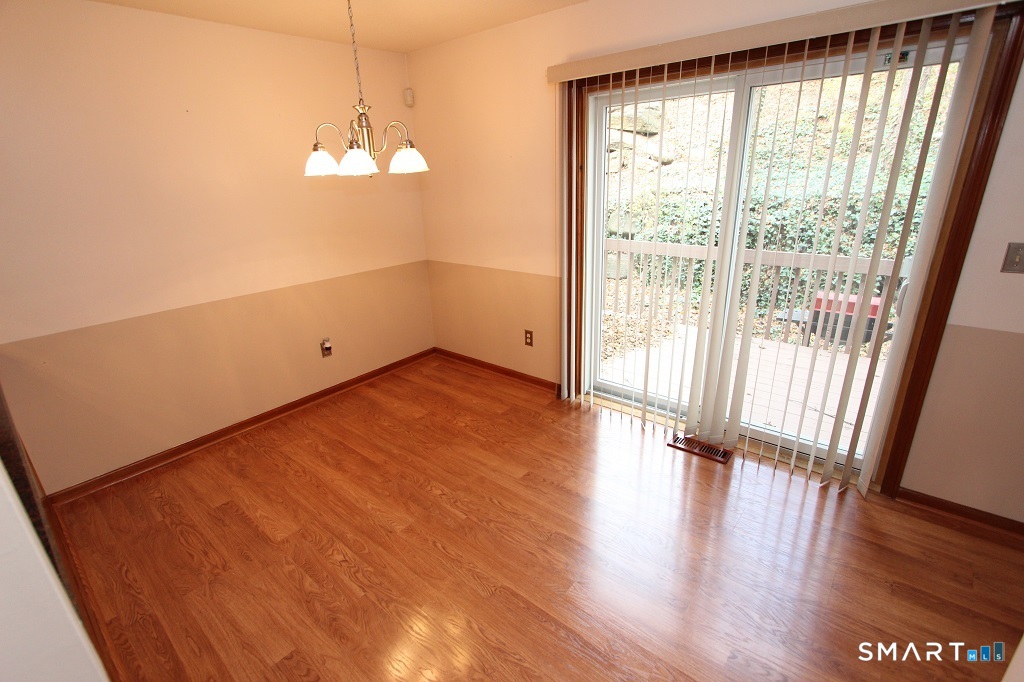 380 Hitchcock Road, Unit 47 Waterbury, CT 06705 - Photo 11 of 21 a view of empty room with wooden floor and fan