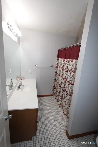 a bathroom with a sink and mirror