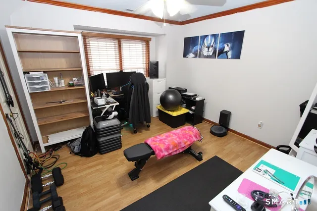 a bedroom with furniture and a window