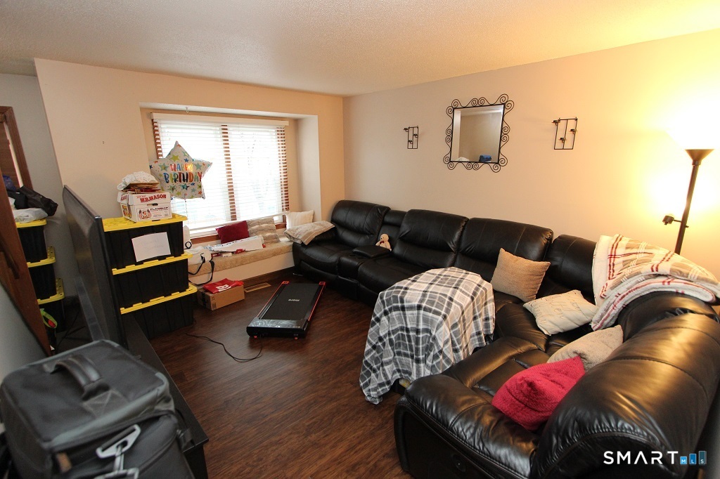380 Hitchcock Road, Unit 47 Waterbury, CT 06705 - Photo 2 of 21 a living room with furniture and a window