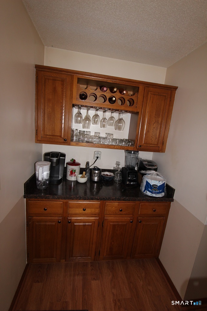 380 Hitchcock Road, Unit 47 Waterbury, CT 06705 - Photo 9 of 21 a kitchen with granite countertop a stove and cabinets