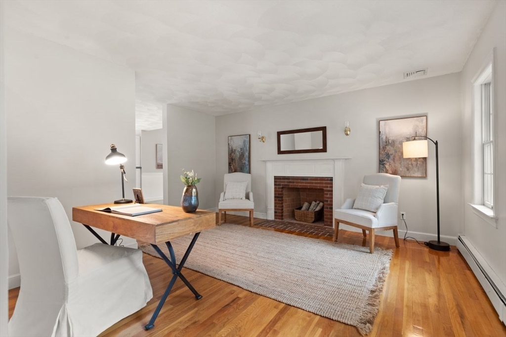 9 Mohawk Lane Lynnfield, MA 01940 - Photo 19 of 42 a living room with furniture and a fireplace