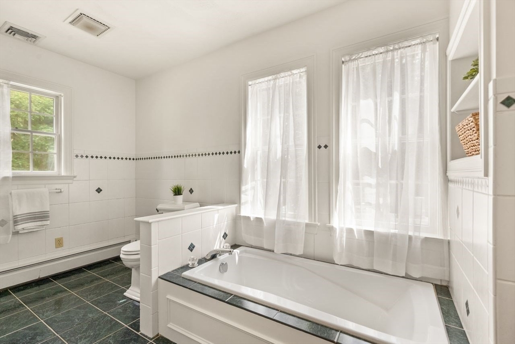 9 Mohawk Lane Lynnfield, MA 01940 - Photo 24 of 42 a bathroom with a sink and a bathtub