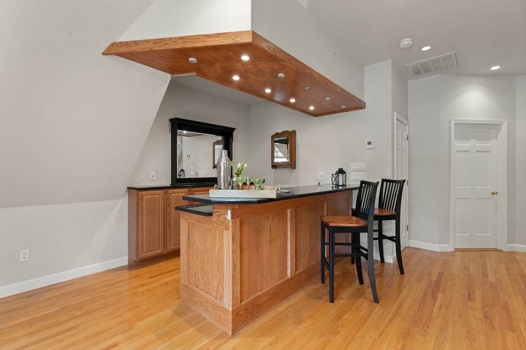 9 Mohawk Lane Lynnfield, MA 01940 - Photo 29 of 42 a hallway with dining table and chairs