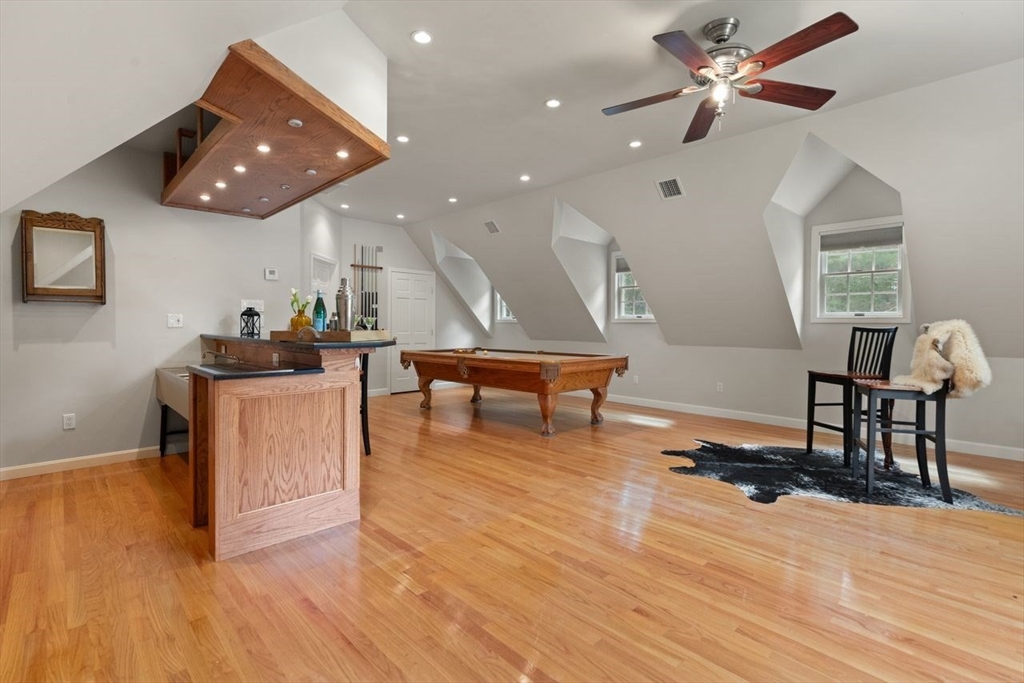 9 Mohawk Lane Lynnfield, MA 01940 - Photo 30 of 42 a living room with furniture and a wooden floor