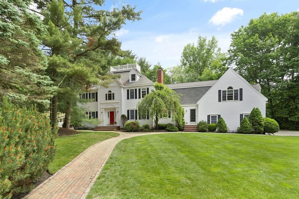 9 Mohawk Lane Lynnfield, MA 01940 - Photo 3 of 42 a front view of a house with a yard