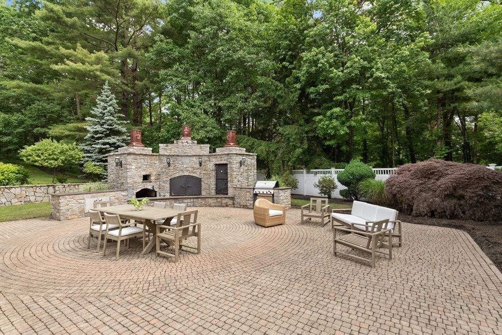 9 Mohawk Lane Lynnfield, MA 01940 - Photo 33 of 42 a view of a patio with table and chairs and potted plants
