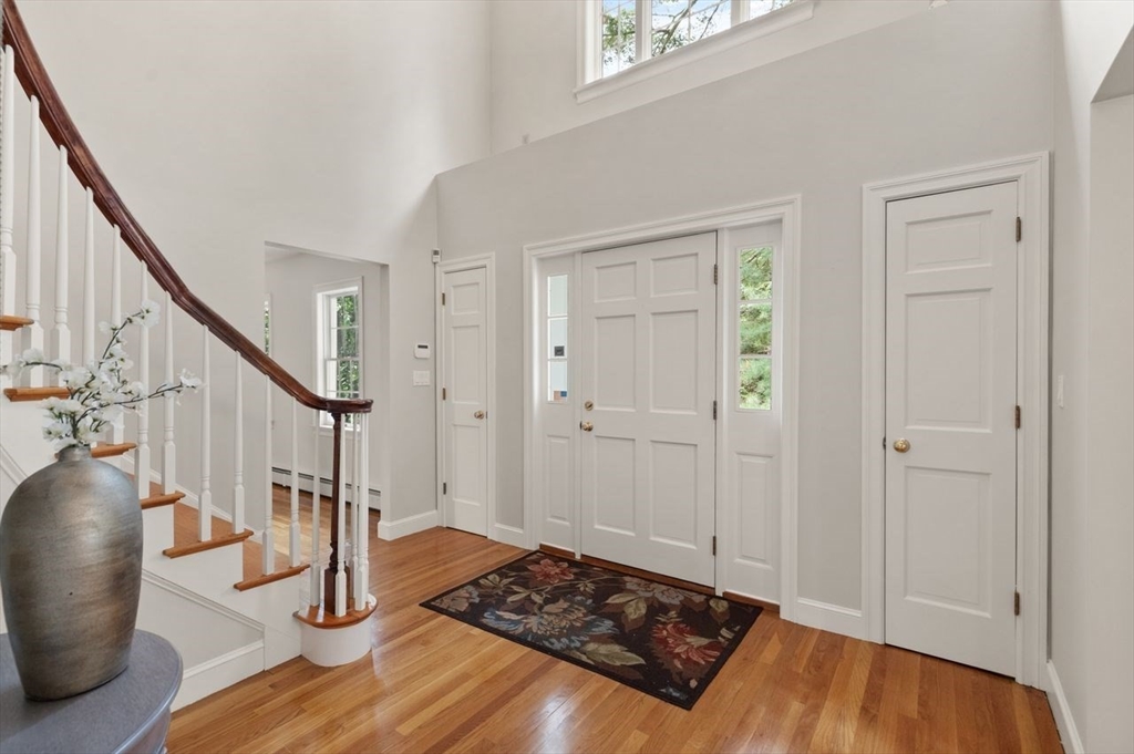 9 Mohawk Lane Lynnfield, MA 01940 - Photo 7 of 42 a view of entryway and hall with wooden floor