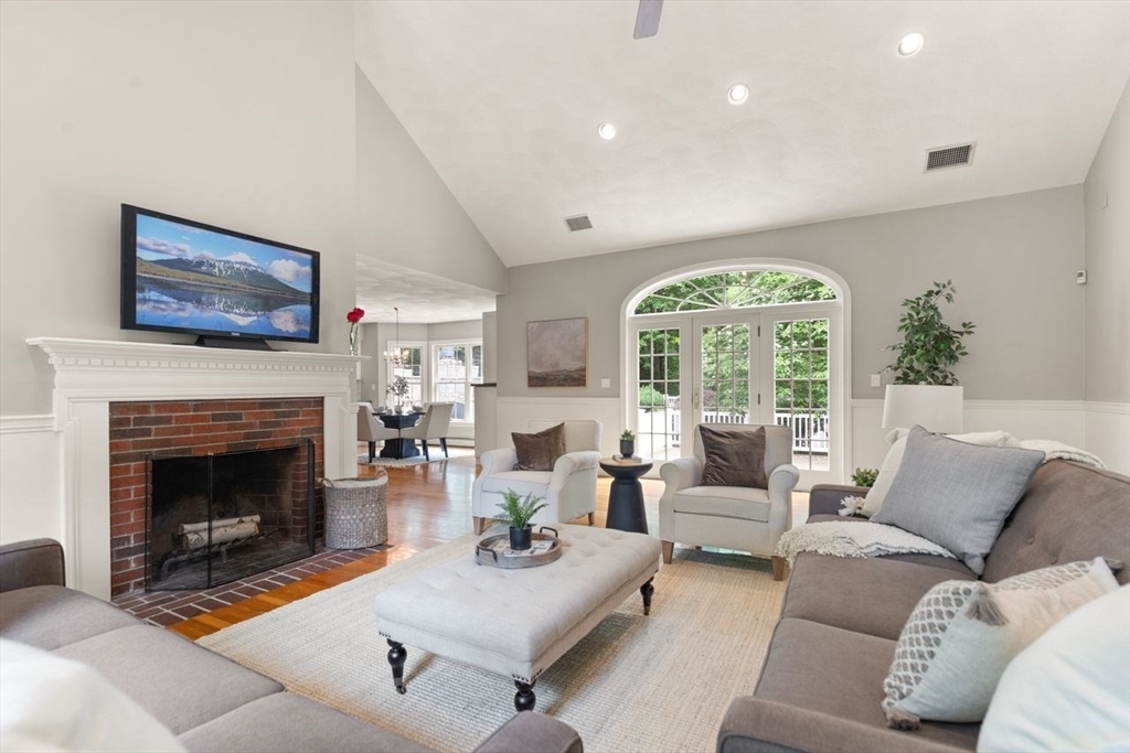 9 Mohawk Lane Lynnfield, MA 01940 - Photo 9 of 42 a living room with furniture fireplace and a large window
