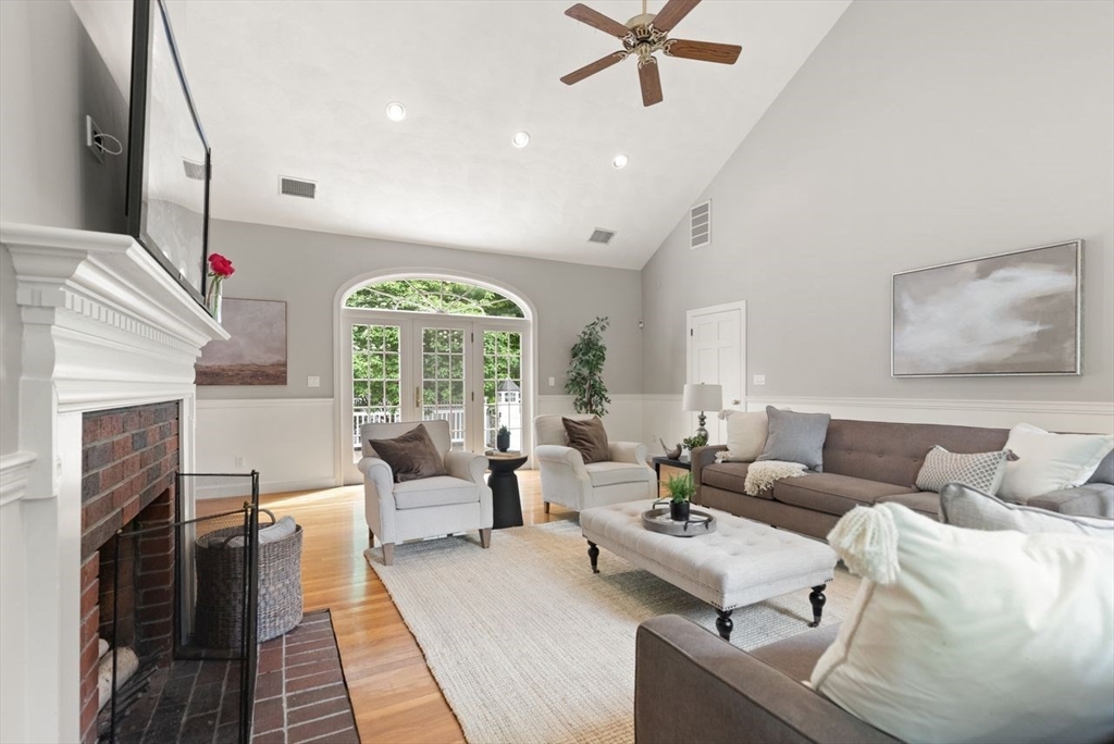 9 Mohawk Lane Lynnfield, MA 01940 - Photo 10 of 42 a living room with furniture and a fireplace