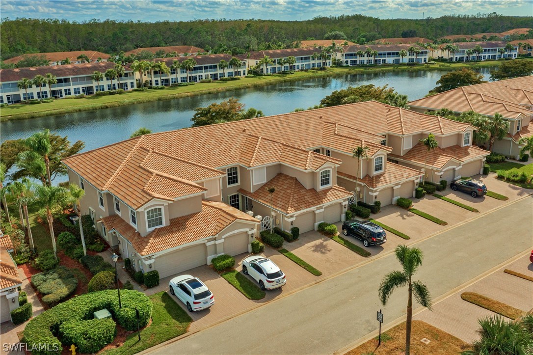 10013 Sky View Way, Unit 1705 Fort Myers, FL 33913 - Photo 1 of 24 an aerial view of a house with outdoor space and lake view