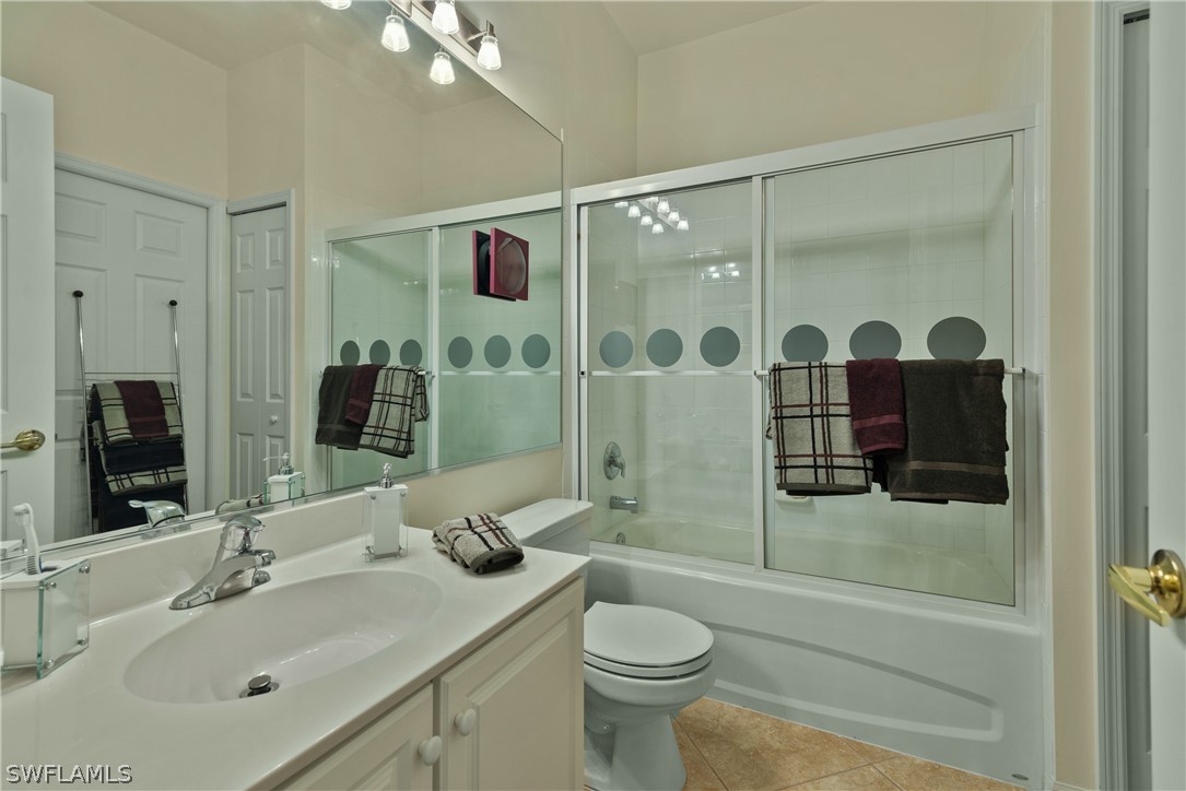10013 Sky View Way, Unit 1705 Fort Myers, FL 33913 - Photo 12 of 24 a bathroom with a sink toilet and shower