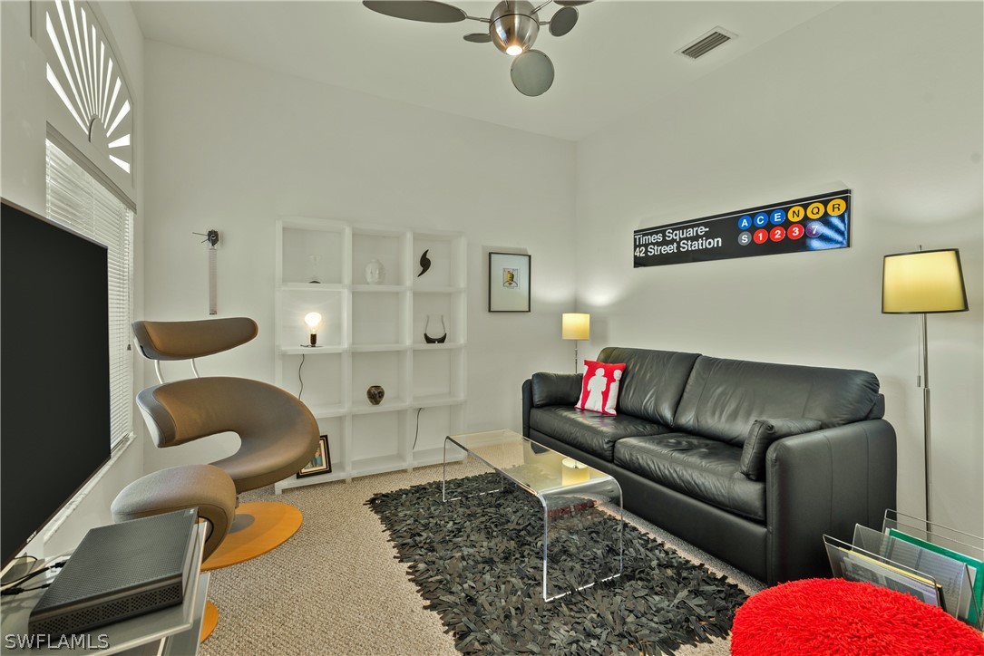 10013 Sky View Way, Unit 1705 Fort Myers, FL 33913 - Photo 13 of 24 a living room with furniture and a rug