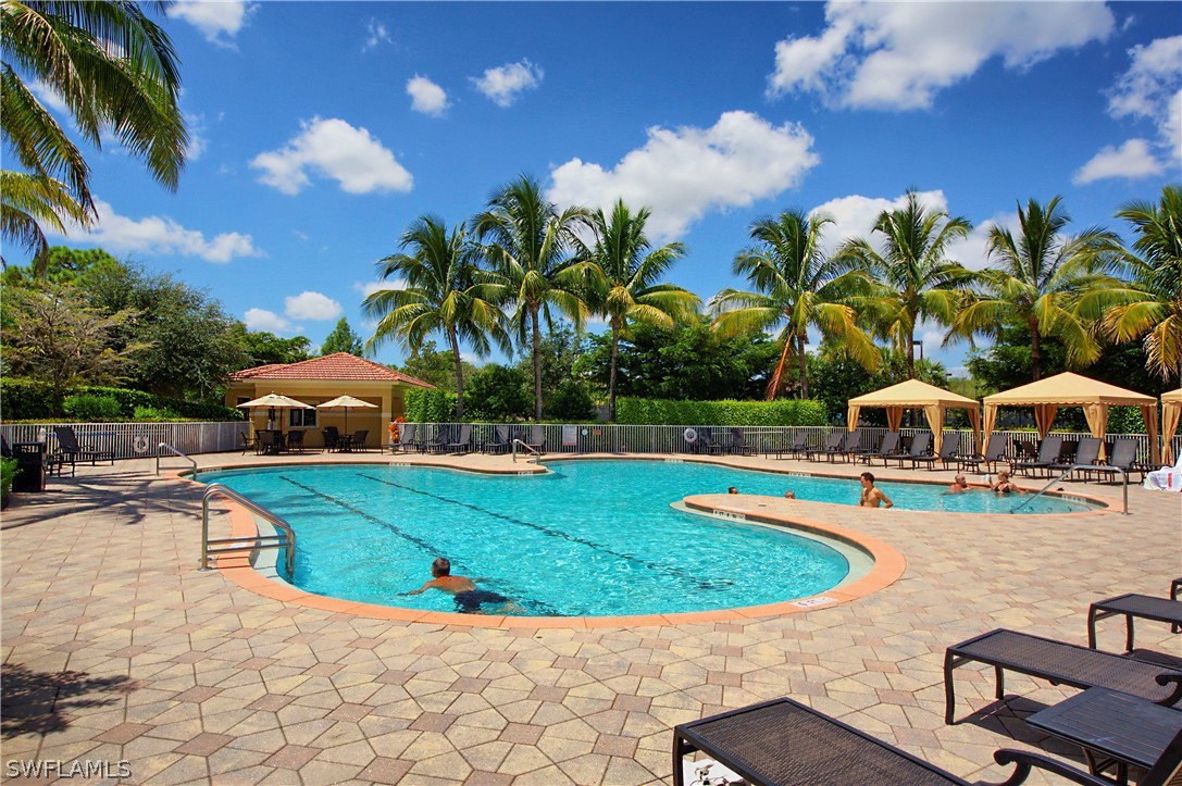 10013 Sky View Way, Unit 1705 Fort Myers, FL 33913 - Photo 20 of 24 a view of a swimming pool with a garden