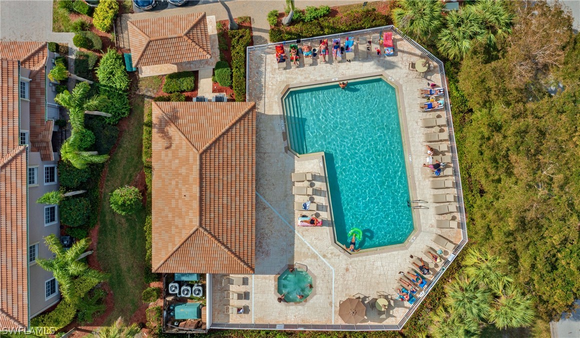 10013 Sky View Way, Unit 1705 Fort Myers, FL 33913 - Photo 23 of 24 an outdoor space with seating area and trees