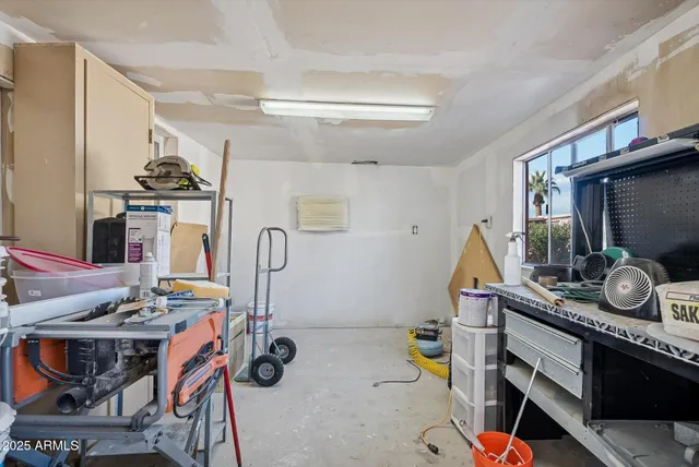 a view of a patio with table and chairs and potted plants