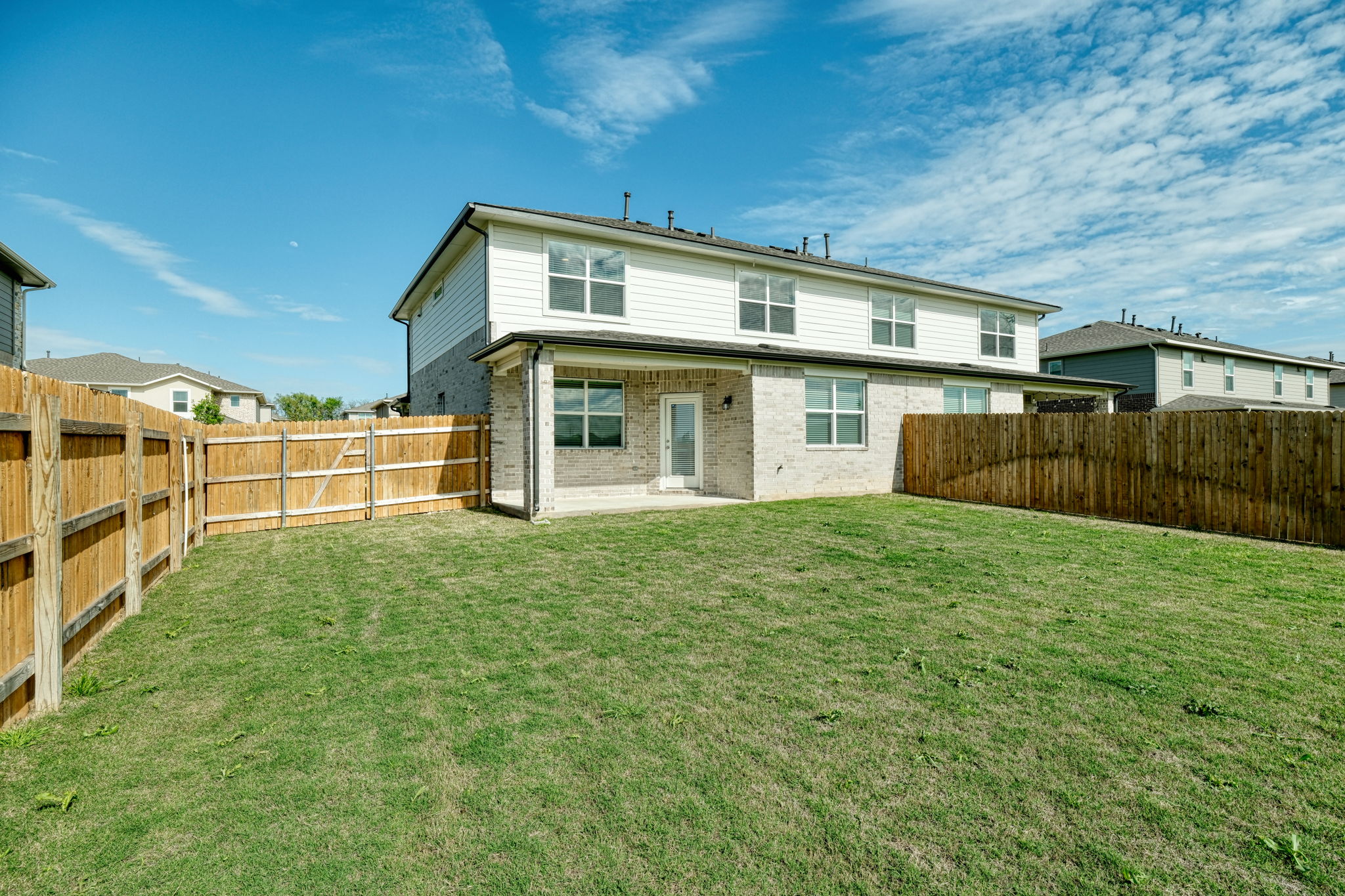 409 Brody Lane Georgetown, TX 78626 - Photo 11 of 14 a view of a house with backyard and wooden fence