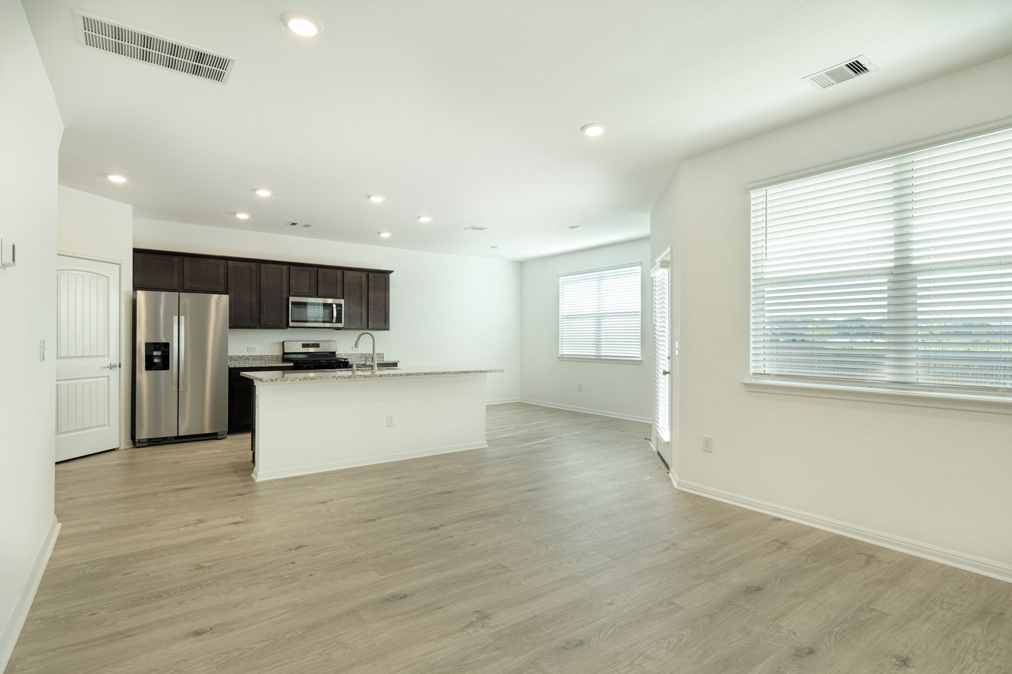 409 Brody Lane Georgetown, TX 78626 - Photo 2 of 14 a view of kitchen with kitchen island sink refrigerator and window