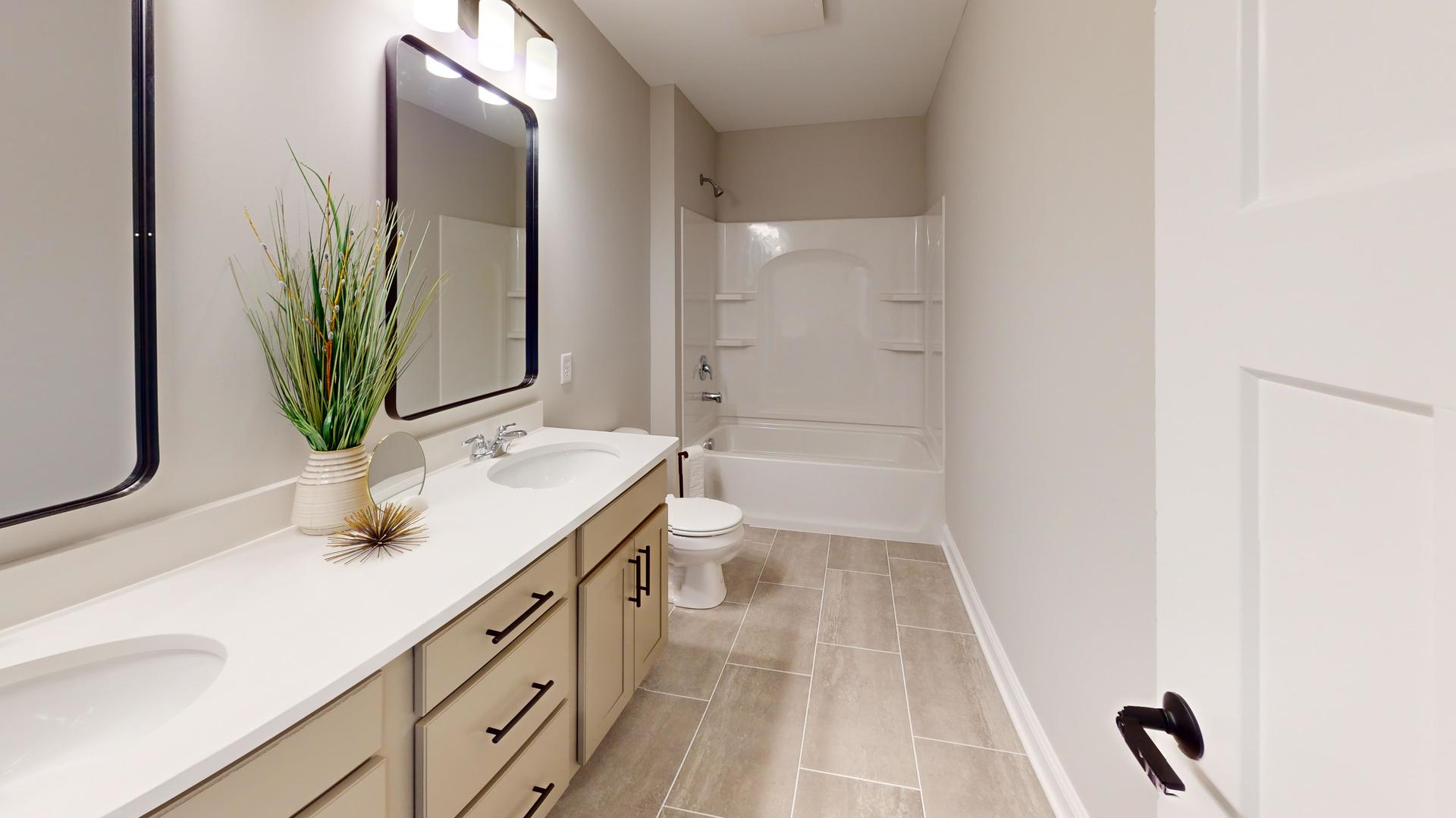 636 Slate Run Elgin, IL 60124 - Photo 27 of 41 a bathroom with a sink a toilet and mirror