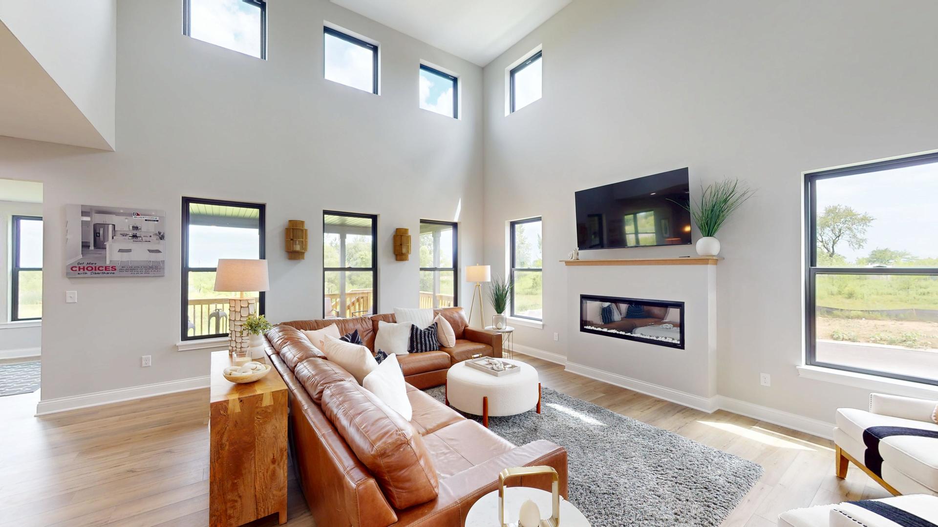 636 Slate Run Elgin, IL 60124 - Photo 6 of 41 a living room with furniture fireplace and a flat screen tv