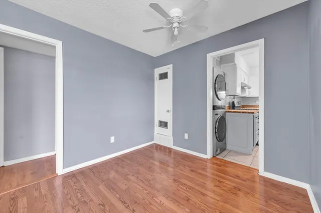a view of a kitchen from the hallway