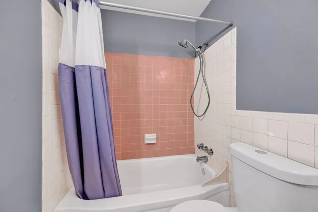 a bathroom with a bath tub and a shower