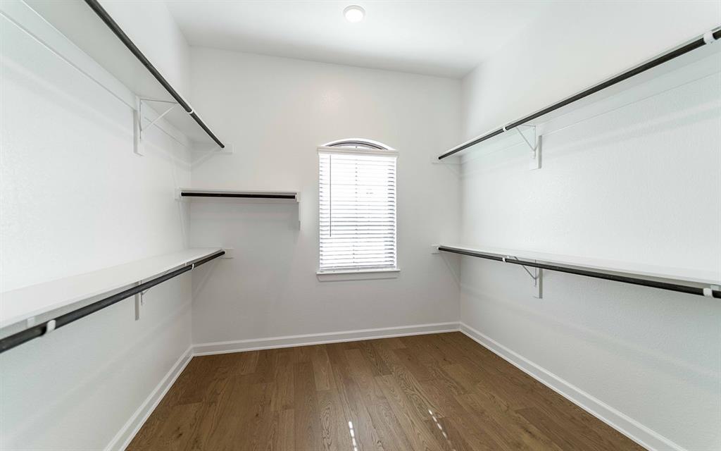 1916 Casting Ridge Mesquite, TX 75181 - Photo 14 of 26 a view of a room with wooden floor and fan
