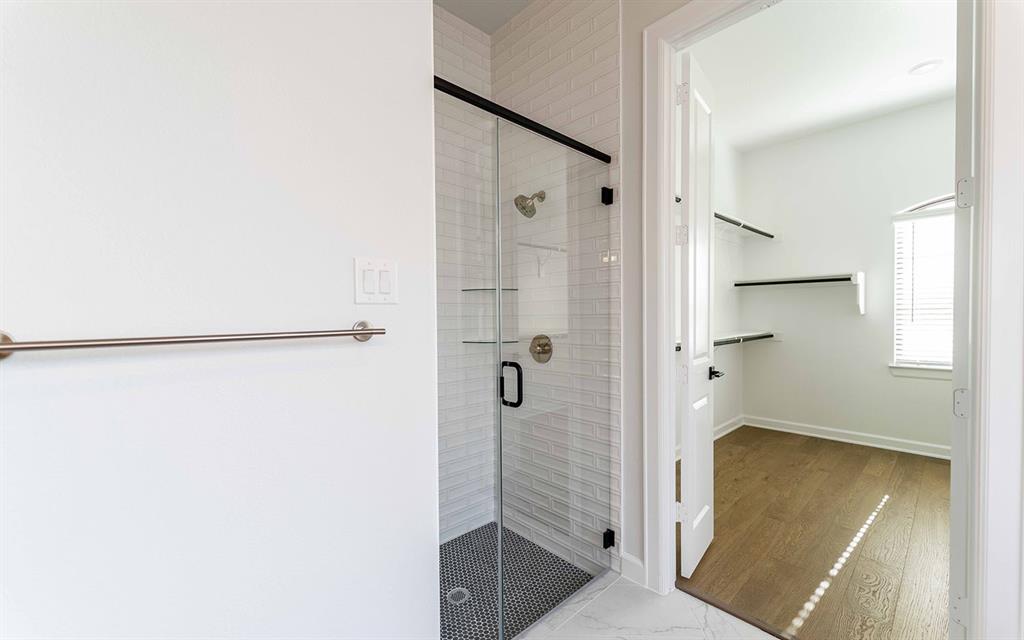 1916 Casting Ridge Mesquite, TX 75181 - Photo 16 of 26 a bathroom with a tub and shower