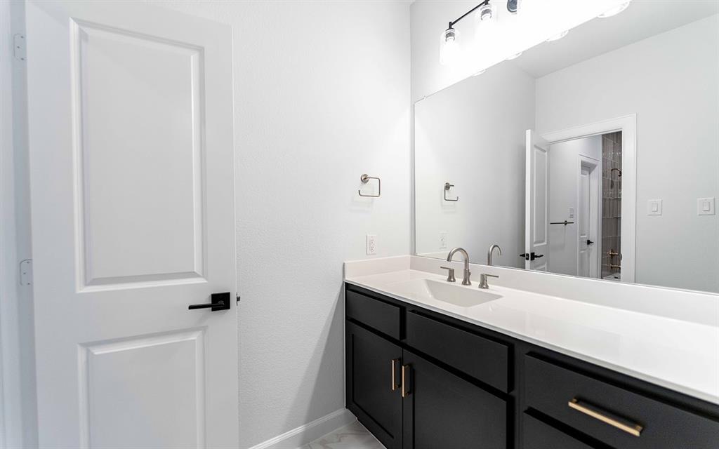 1916 Casting Ridge Mesquite, TX 75181 - Photo 22 of 26 a bathroom with a sink and a mirror