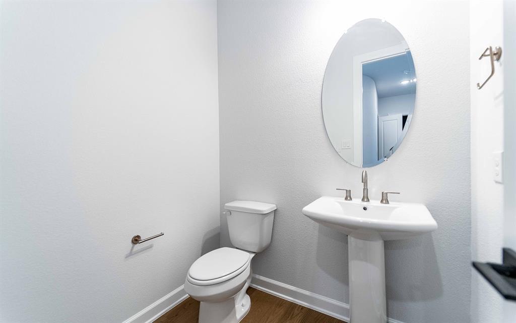 1916 Casting Ridge Mesquite, TX 75181 - Photo 24 of 26 a bathroom with a sink toilet and a mirror