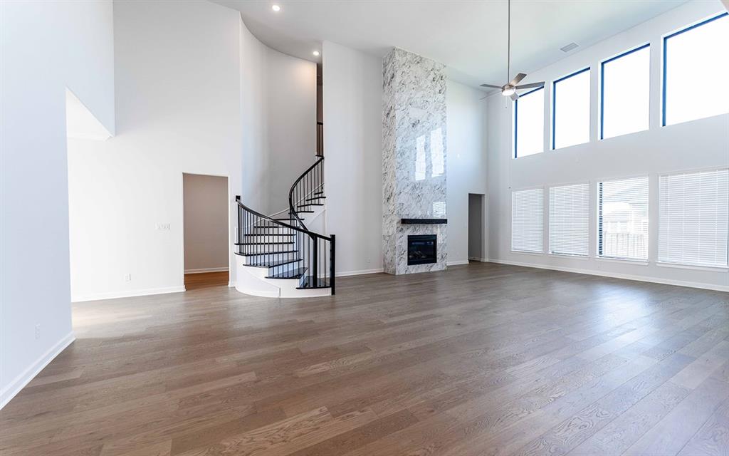 1916 Casting Ridge Mesquite, TX 75181 - Photo 3 of 26 a view of an empty room with wooden floor and a window