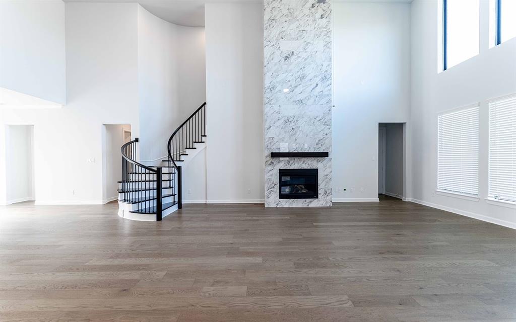 1916 Casting Ridge Mesquite, TX 75181 - Photo 4 of 26 a view of an empty room with stairs and a fireplace