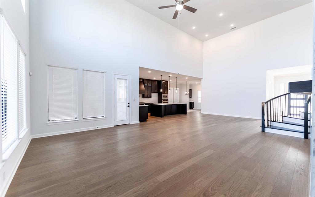 1916 Casting Ridge Mesquite, TX 75181 - Photo 5 of 26 a view of empty room with wooden floor and window