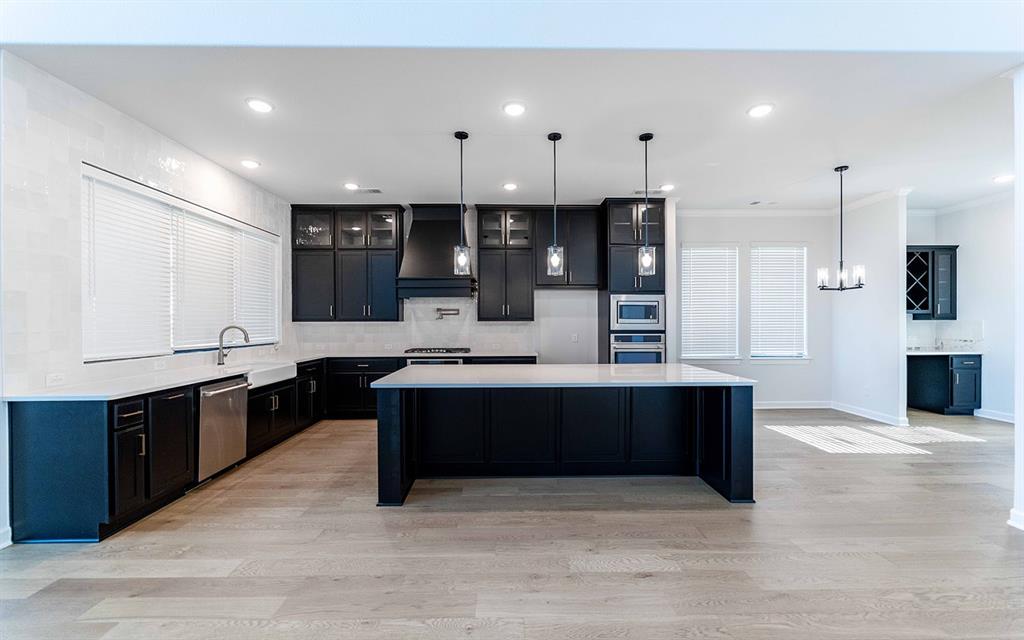 1916 Casting Ridge Mesquite, TX 75181 - Photo 8 of 26 a large kitchen with stainless steel appliances kitchen island granite countertop a large counter top and stove