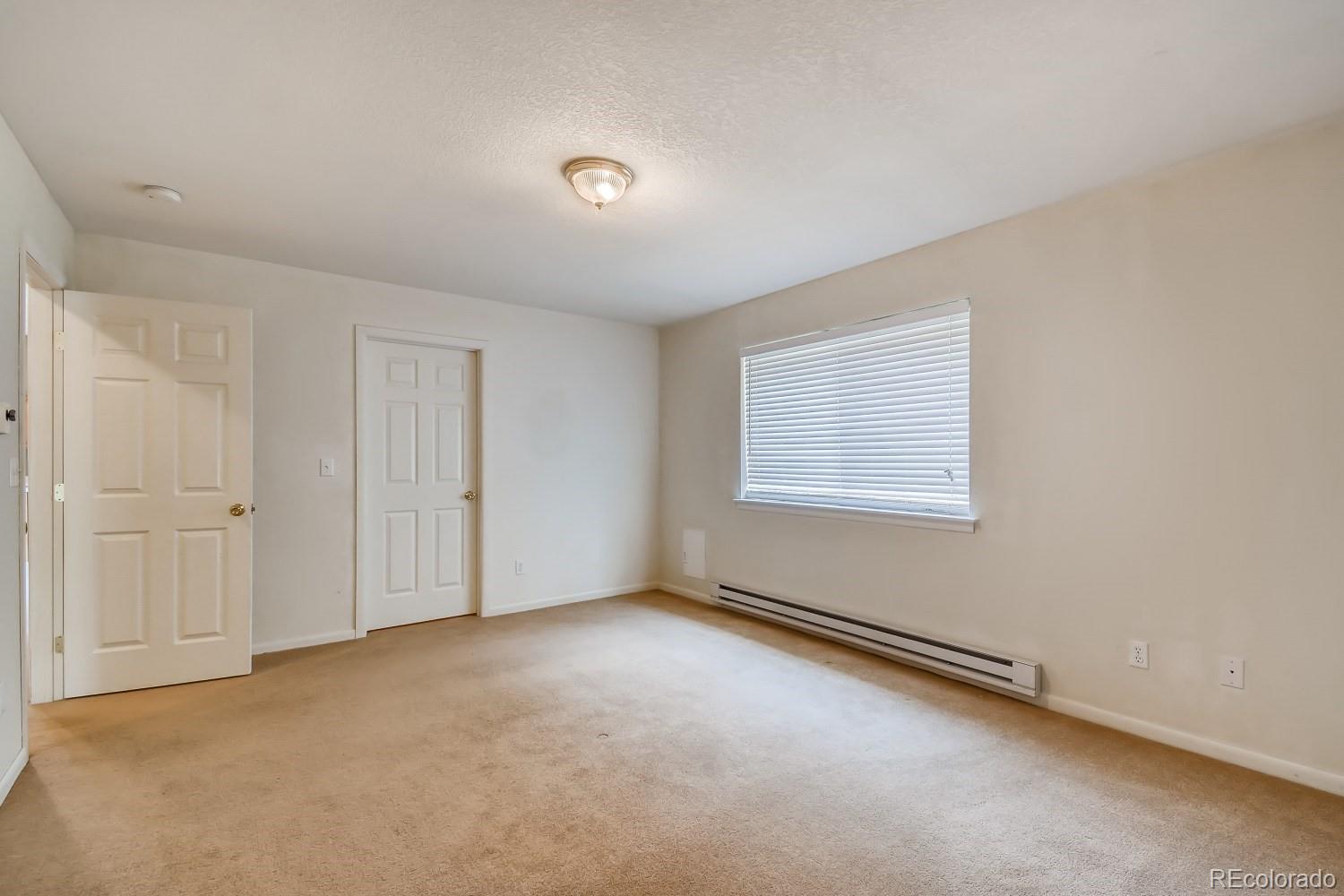541 Paiute Road Evergreen, CO 80439 - Photo 11 of 22 an empty room with windows