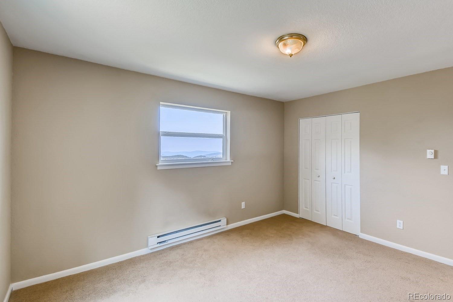 541 Paiute Road Evergreen, CO 80439 - Photo 14 of 22 a view of an empty room