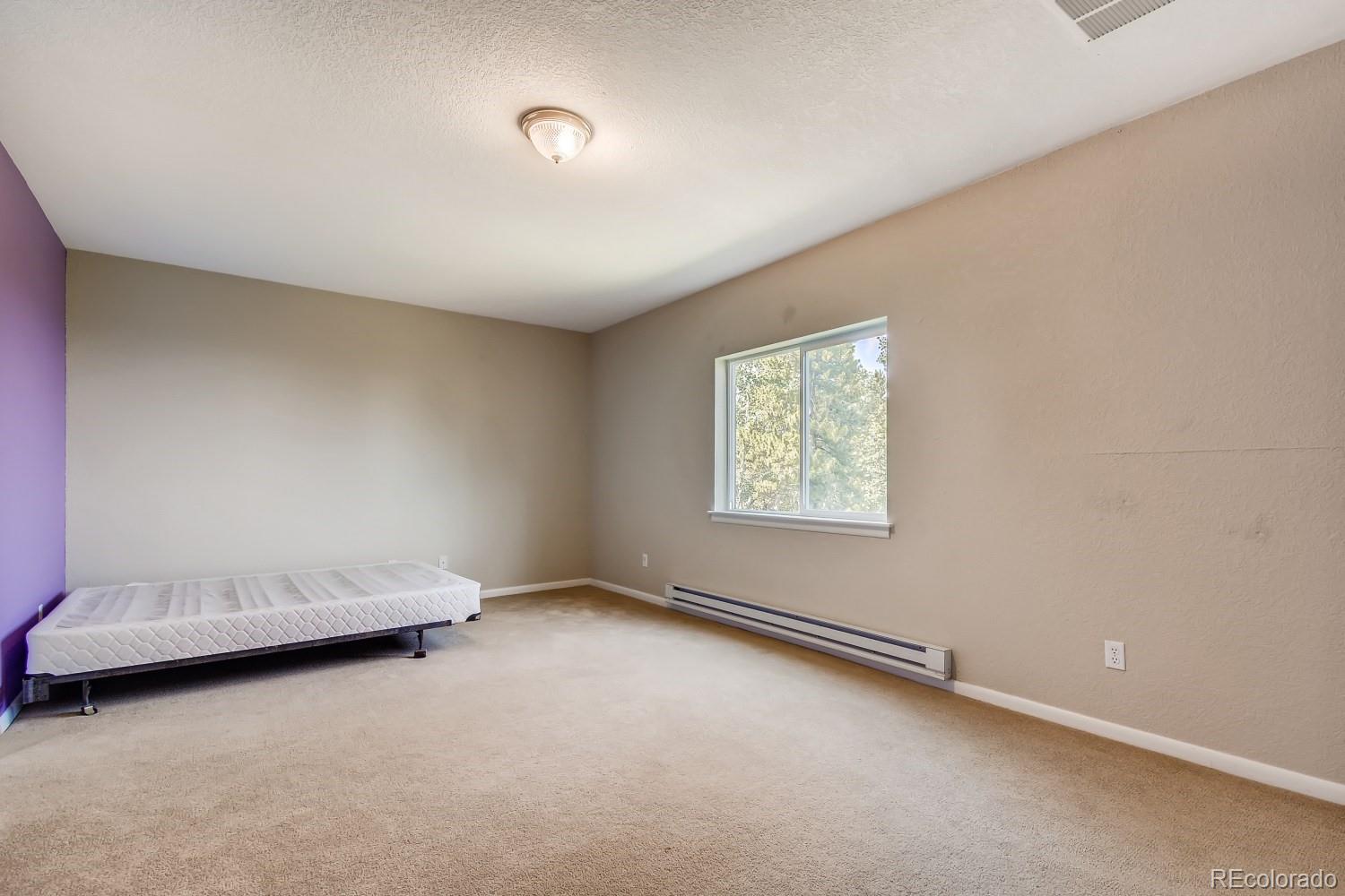541 Paiute Road Evergreen, CO 80439 - Photo 16 of 22 an empty room with a window