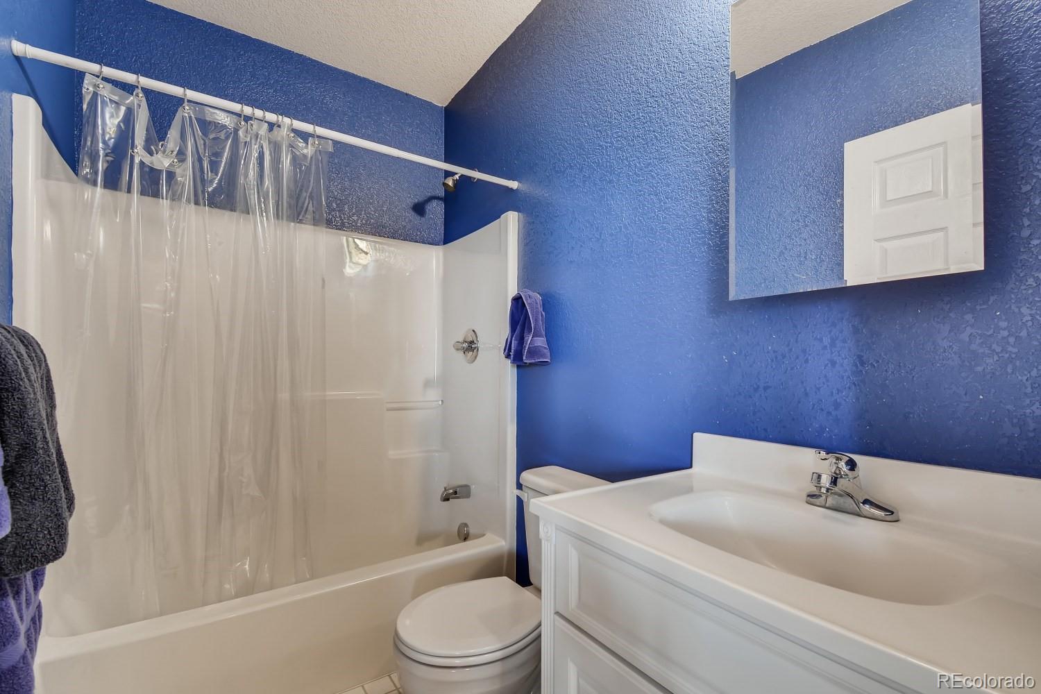 541 Paiute Road Evergreen, CO 80439 - Photo 17 of 22 a bathroom with a toilet a sink and a shower