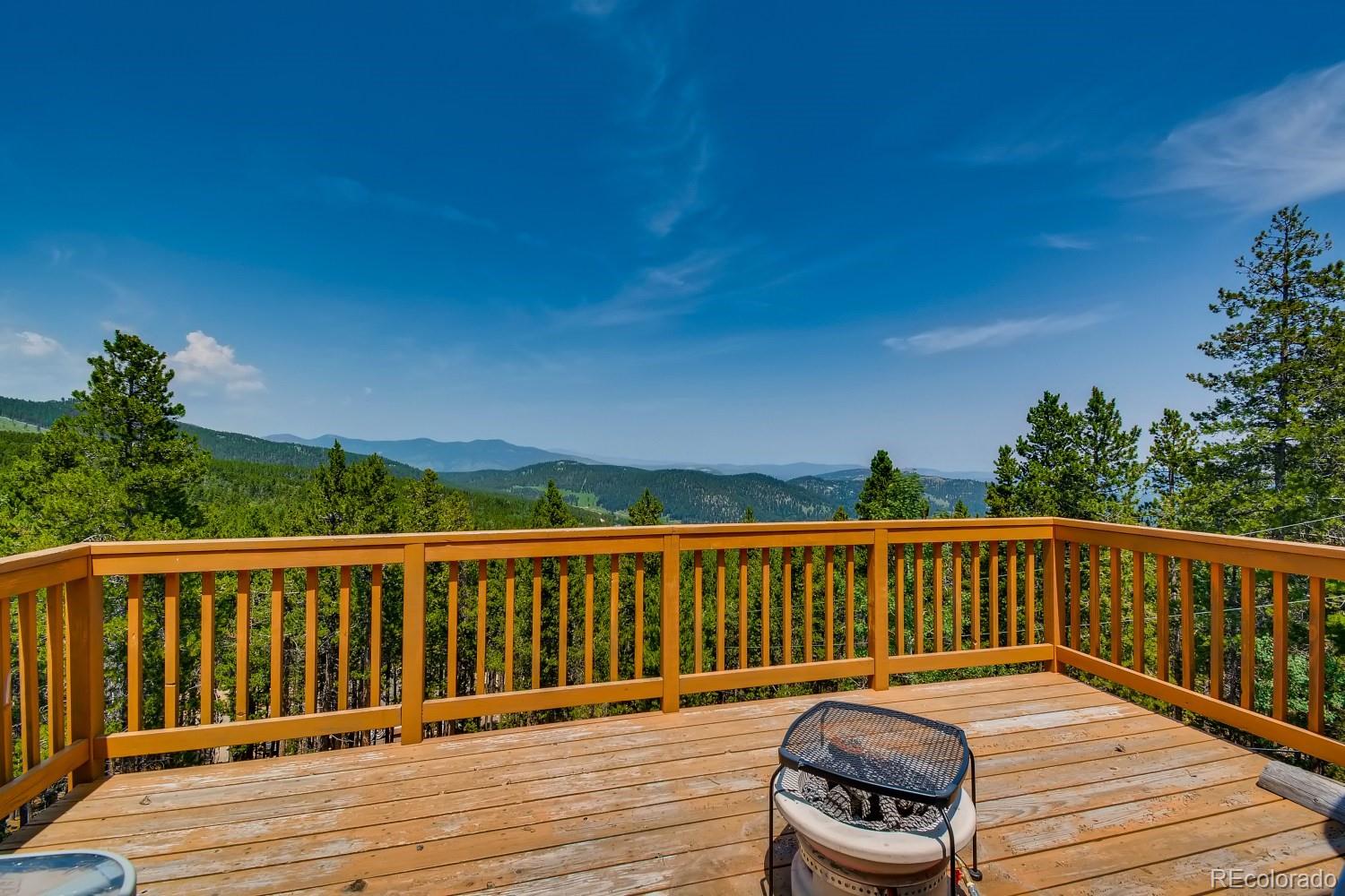 541 Paiute Road Evergreen, CO 80439 - Photo 19 of 22 a view of deck with wooden floor and seating space