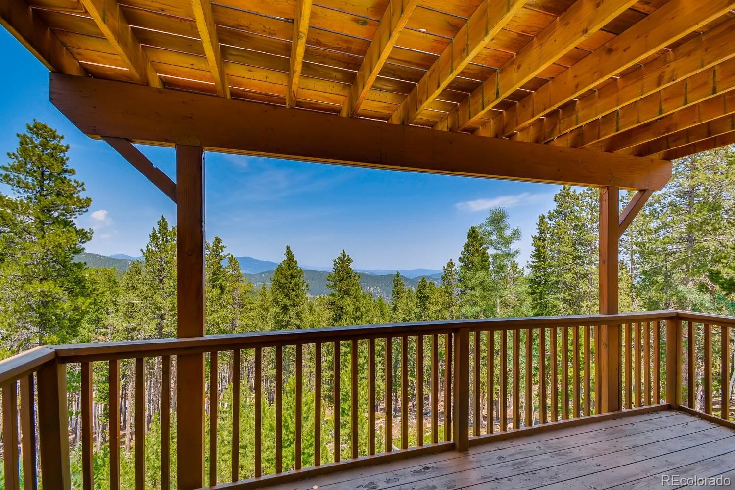 541 Paiute Road Evergreen, CO 80439 - Photo 20 of 22 a view of balcony with wooden floor