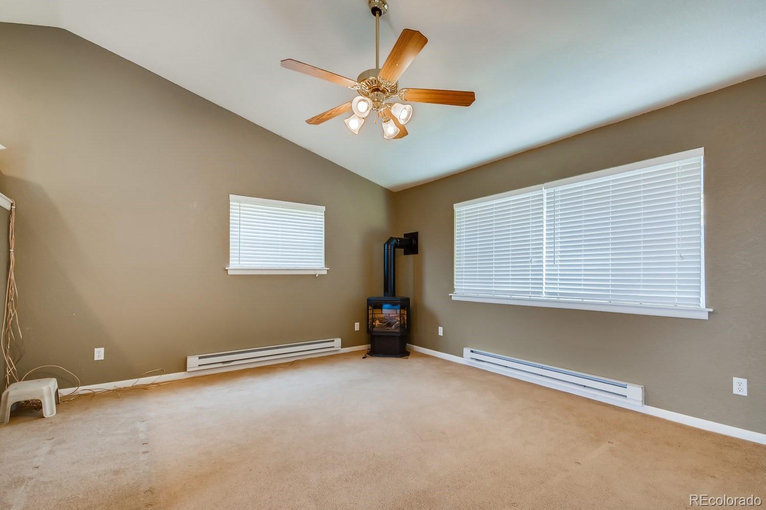 541 Paiute Road Evergreen, CO 80439 - Photo 4 of 22 a view of a livingroom with a window and a ceiling fan